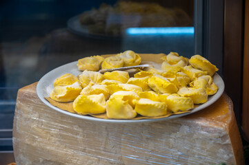 Italian food, fresh homemade stuffed pasta tortelli or ravioli dumplings ready to cook, Milan, Lombardy, Italy