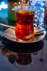 Turkish sweet tea served in traditional glass in restaurant in Istanbul, Turkey