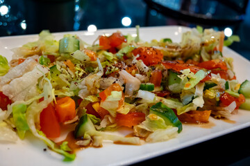 Green vegetables salad for turkish mixed grill meat, chicken wings, lamb, beef shashlik, kebab in restaurant