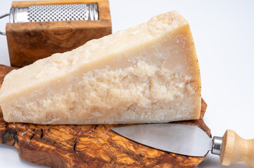 Traditional italian food - 22 months aged in caves Italian parmesan hard cheese from Parmigiano-Reggiano, Italy
