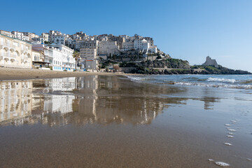 View on sandy beach and sea water in medieval small touristic coastal town Sperlonga and sea shore, Latina, Italy