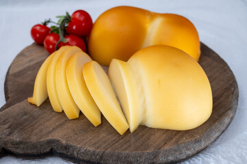 Cheese collection, Italian cheese scamorza, caciocavallo, provolone made from cow milk in South Italy yellow smoked cheese