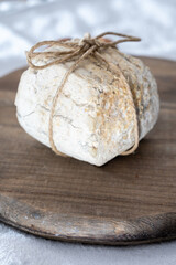 Fototapeta na wymiar Italian hard cheese truffelino romano with black summer truffles mushrooms close up