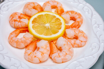 Catch of the day, fresh cooked shrimps served with lemon and garlic sauce in seafood restaurant