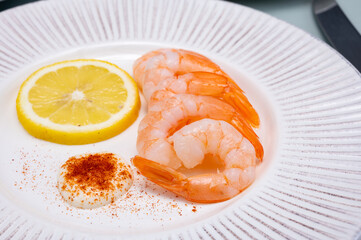 Catch of the day, fresh cooked shrimps served with lemon and garlic sauce in seafood restaurant