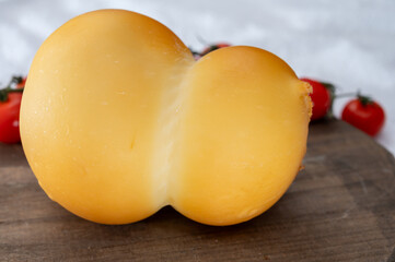 Cheese collection, Italian cheese scamorza, caciocavallo, provolone made from cow milk in South Italy yellow smoked cheese