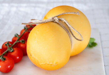 Cheese collection, Italian cheese scamorza, caciocavallo, provolone made from cow milk in South Italy yellow smoked cheese