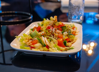 Green vegetables salad for turkish mixed grill meat, chicken wings, lamb, beef shashlik, kebab in restaurant