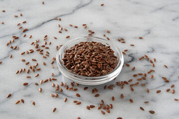 Close-up of flax seeds on a white background