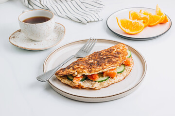 Oatmeal pancake stuffed with cream cheese, salmon and cucumber