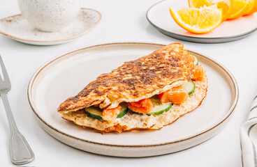 Oatmeal pancake stuffed with cream cheese, salmon and cucumber