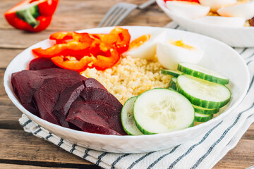 Healthy Buddha bowl with millet and beets