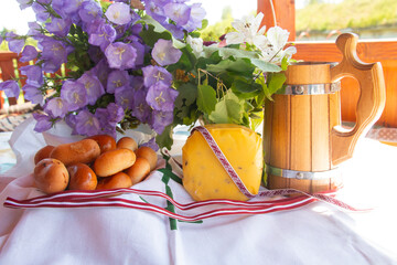 John's Day, a pagan folk holiday in midsummer, celebrated on June 24 throughout Latvia, a festive table of cheese with cumin and beer