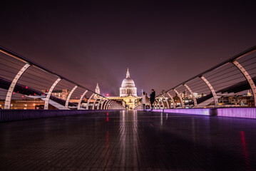 St. Paul's Cathedral in London from Millennium Bridge at night