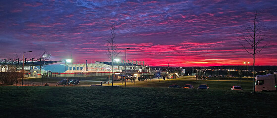View of the soccer stadium in Zwickau during a spectacular sunset before the FSV Zwickau match