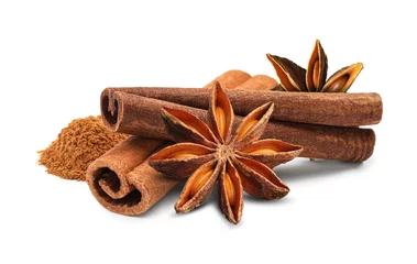 Rolgordijnen Aromatic cinnamon sticks, powder and anise stars isolated on white © New Africa