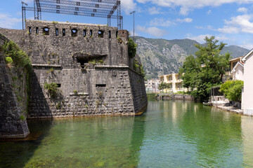 View of river Scurda and stone City Walls with Bembo Bastion, Kotor, Montenegro