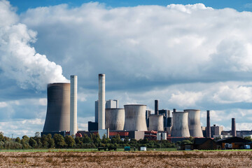 Cooling towers of a nuclear power plant on the background of a cloudy sky