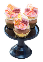 Colorful pink, orange and yellow cupcakes with marshmallows, pink chocolate, sweets isolated on white background, png, closeup