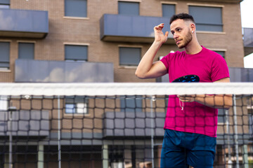 Pickleball Player Wiping Sweat During Game