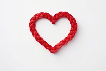 A closed heart composed of red braided rope, centered on a seamless white background, symbolizing love and unity. Closed Red Braided Heart Centered on White Background