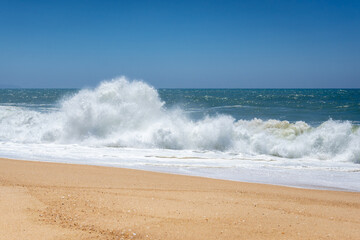 Waves seen from North Beach famous for giant waves in Nazare town on so called Silver Coast, Oeste region of Portugal
