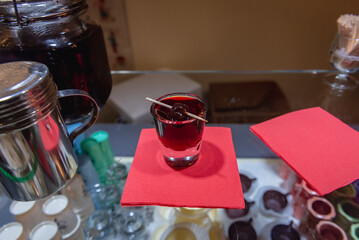 Shot of ginjinha in a shop on Rua Direita street in Obidos town, Oeste region, Leiria District of Portugal