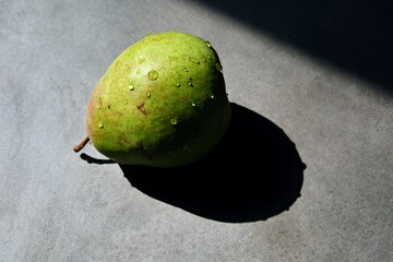 An appetite, juicy, colorful pear. An organic pear in close-up.