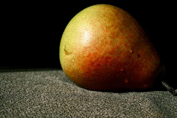 An appetite, juicy, colorful pear. An organic pear in close-up.