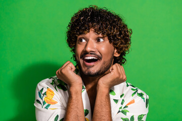 Photo portrait of pretty young male look empty space admire dressed stylish citrus print outfit isolated on green color background