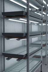 Empty metal storage racks with wooden planks and gray shelves