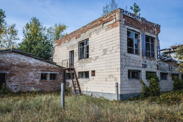 Fototapeta na wymiar Abandoned building in kolkhoz in Korohod village in Chernobyl Exclusion Zone, Ukraine