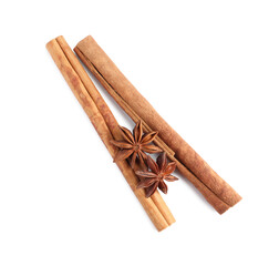 Cinnamon sticks and anise stars isolated on white, top view