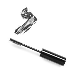Smear of mascara and applicator isolated on white, top view
