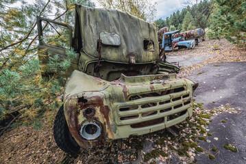 Old car on wrecking yard near Illinci village in Chernobyl Exclusion Zone, Ukraine