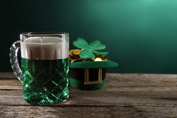 St. Patrick's day celebration. Green beer, leprechaun hat with gold and decorative clover leaf on...