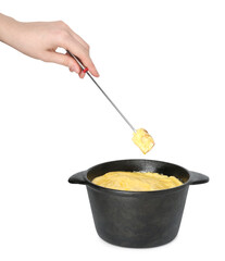Woman dipping piece of bread into fondue pot with tasty melted cheese on white background, closeup