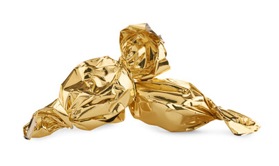 Candies in golden wrappers isolated on white