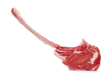 Raw tomahawk steak isolated on white background