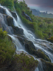 An ethereal feeling at stunning Brides Veil Falls with famous Old Man of Storr