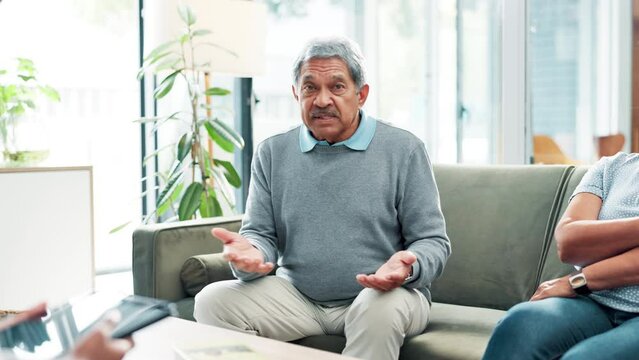 Senior couple, therapist and consulting with tablet for conflict, argument or problems at home. Elderly man and woman talking to psychologist with technology for support or advice at retirement house