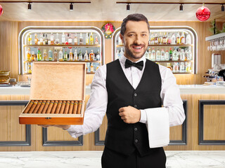 Waiter holding a box of cigars