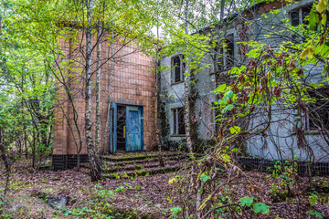 Building in abandoned summer camp in forest area of Chernobyl Exclusion Zone, Ukraine