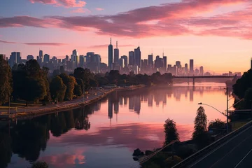 Wall murals Reflection City skyline reflected in water at sunset, creating a stunning natural landscape