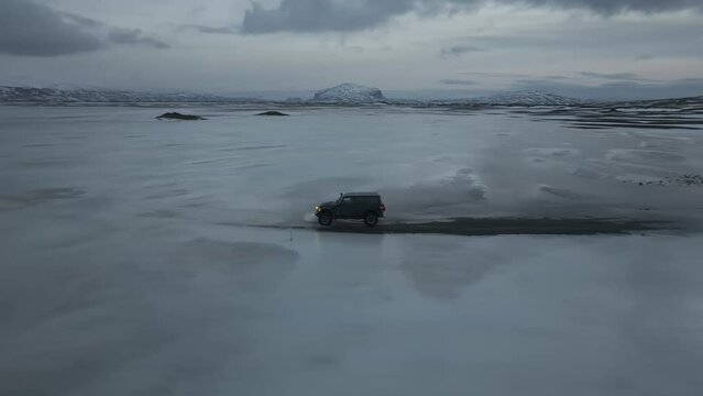 Aerial video on a Jeep Rubicon in a snowy area on the roads of Iceland in winter