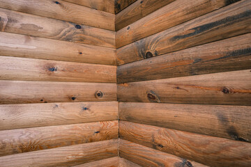 Corner of blockhouse from logs. Texture of logs from the wooden house - obrazy, fototapety, plakaty