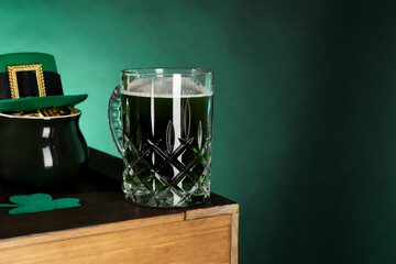 St. Patrick's day celebration. Green beer, leprechaun hat, pot of gold and decorative clover leaf...