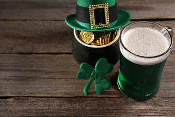 St. Patrick's day celebration. Green beer, leprechaun hat, pot of gold and decorative clover leaf...