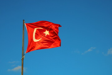 Turkish national flag waving in the blue sky