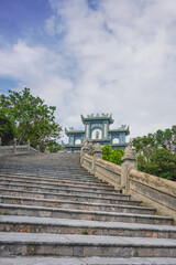 Fototapeta na wymiar The gateway to Monkey Mountain in Da Nang, Vietnam, walking through the stair to reach a majestic Guanyin statue, the goddess of mercy